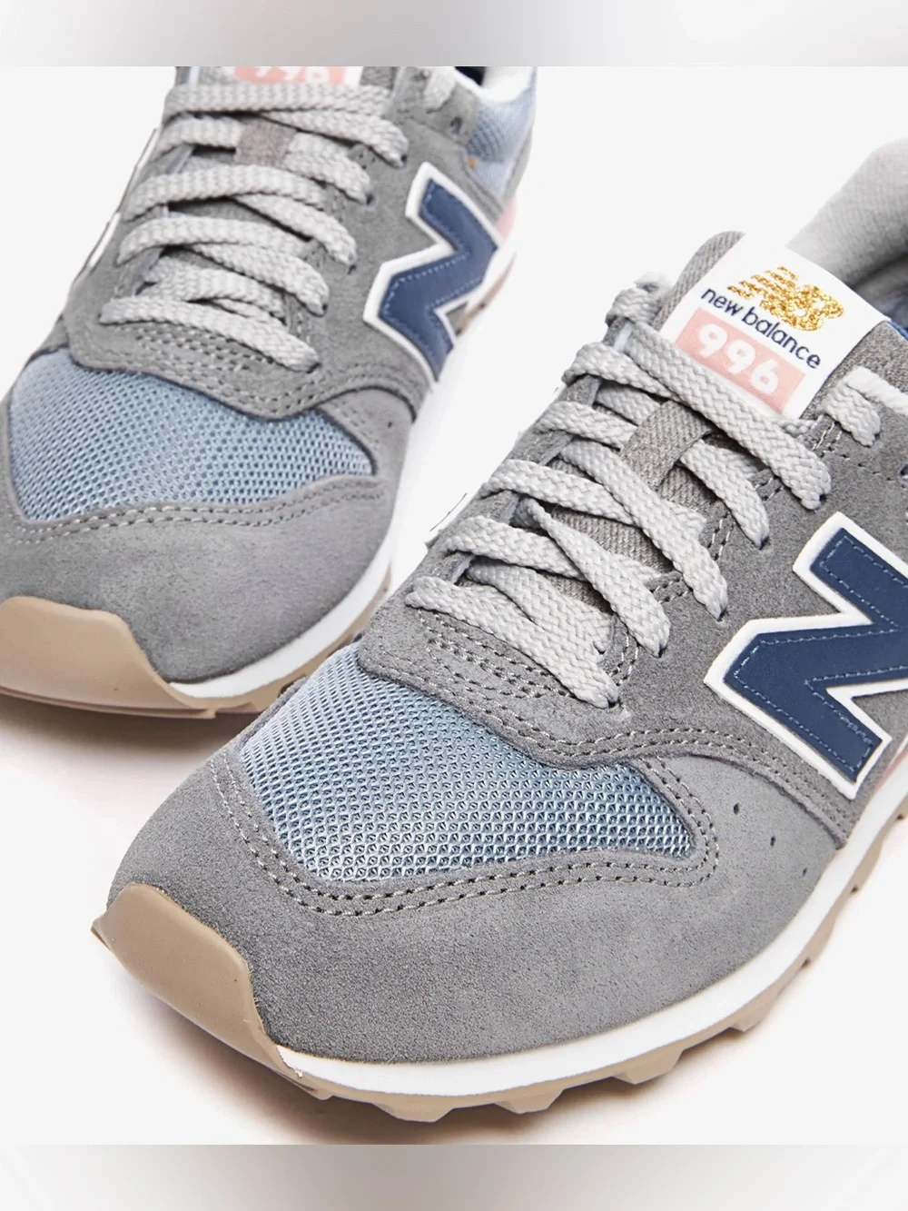 New Balance 996 sneakers in a grey, blue, and pink colorway size 6.5